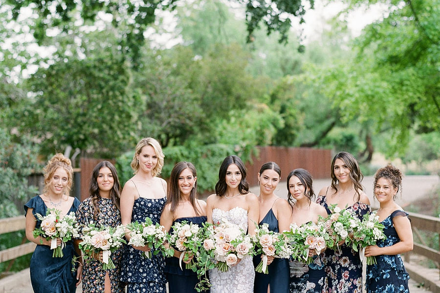 floral maxi dress and navy suit couple