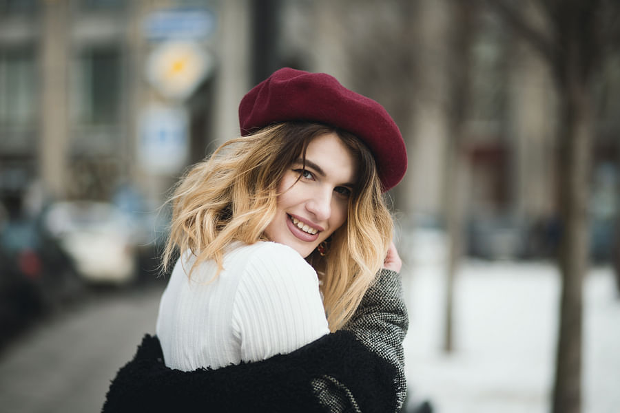 A selection of cold-weather accessories in various winter colors and styles